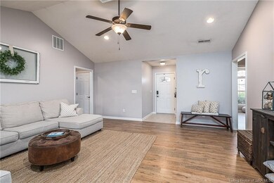Large living room with vaulted ceilings.