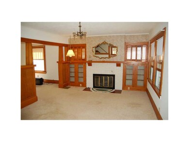 Living Room. Natural woodwork thru-out.  Built-in 