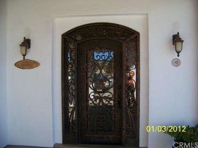 Heavy iron and glass front door.