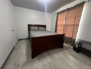 Unfurnished bedroom with a textured ceiling