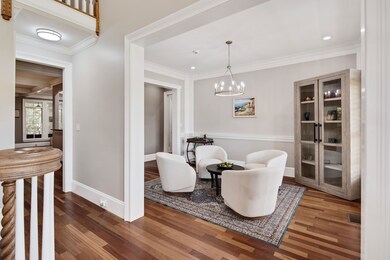 Sitting room with an inviting chandelier, ornament