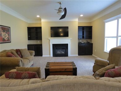 The family room is warm and inviting with its beau