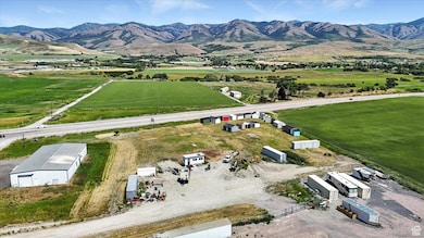 Aerial view of sparsely populated area with a mountain backdrop