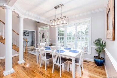 Formal Dining Room has crown molding and chair rail.