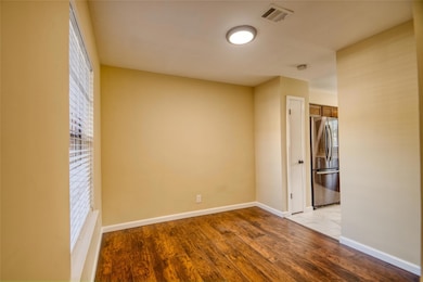 Empty room featuring light wood-type flooring