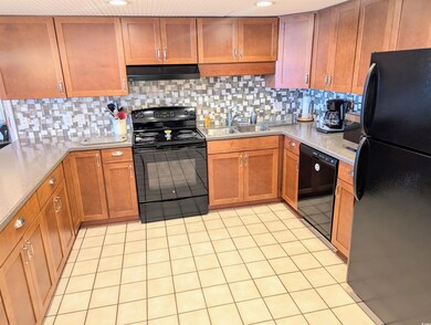 Kitchen with under cabinet range hood, light count