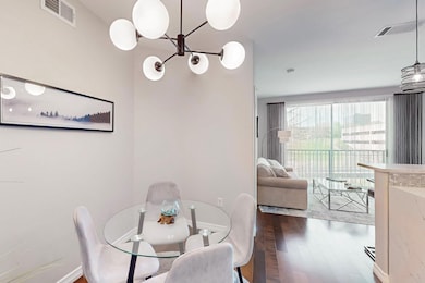 Dining room featuring baseboards, visible vents, a
