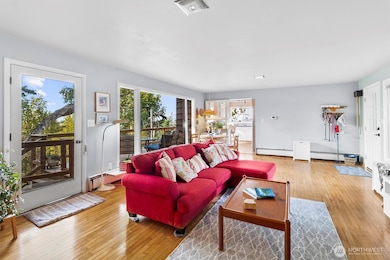 Stylish and versatile layout highlighted by hardwood flooring and access to the patio, enhancing indoor/outdoor living.