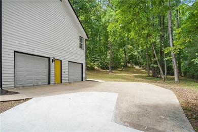 Garage featuring driveway