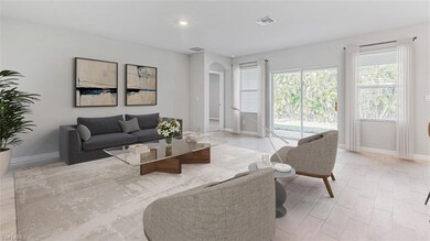Living room with arched walkways, baseboards, and recessed lighting