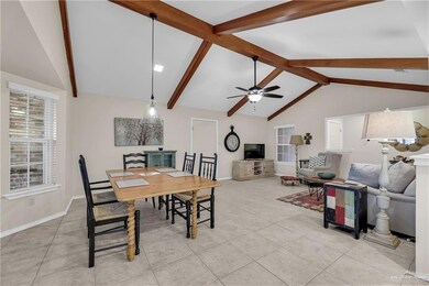 Dining space featuring ceiling fan and light tile patterned flooring