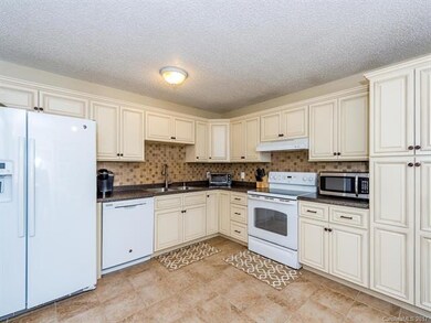 Updated kitchen with loads of cabinet space.
