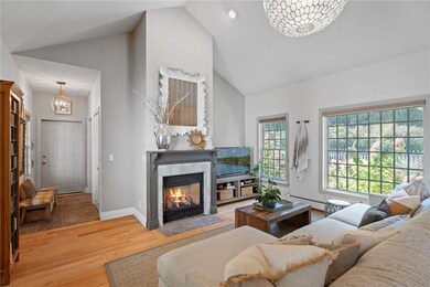 Family Room with gas fireplace.  Door to garage.
