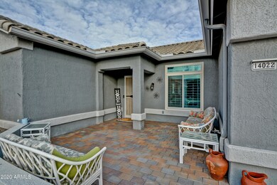 Large front walled paverstone patio