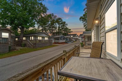 Balcony at dusk with a residential view and stairw