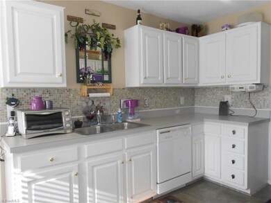 You'll have plenty of counter and cabinet space. There is also a separate pantry.
