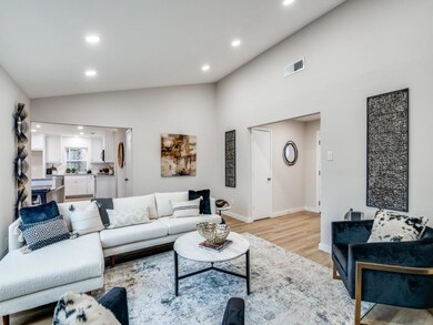 Living room with lofted ceiling and light wood-typ