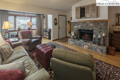 STONE WOODBURNING FIREPLACE IS THE FOCAL POINT.  C