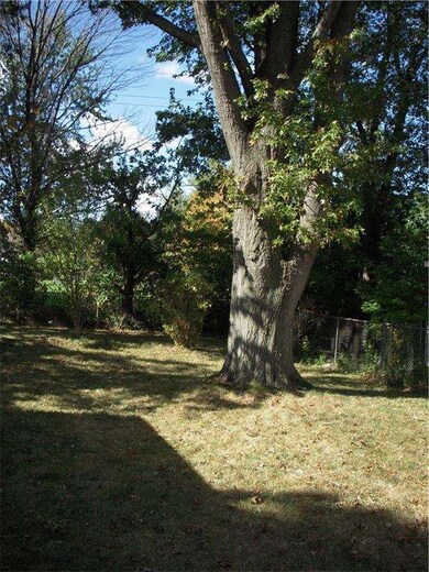 Fenced Backyard with mature trees