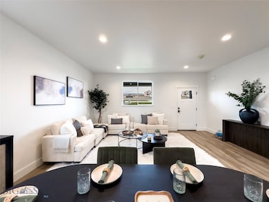 Living room with dining area looking towards open