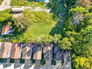 This home has plenty of green areas around it.