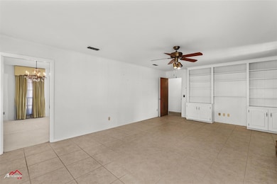 Tiled empty room with ceiling fan with notable cha