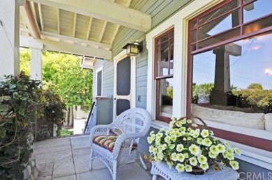 Charming front porch, view reflected in window.