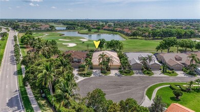 Birds eye view of property with golf course view,