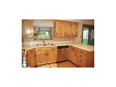 The kitchen features parquet floors, built-in oven