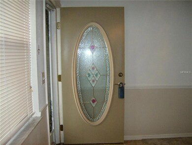 Stained Glass Front Door next to picture window.