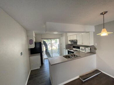 Kitchen with white appliances, under cabinet rang