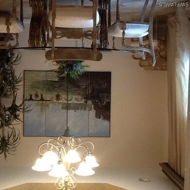 Dining room with detailed tray ceiling.