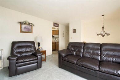 Upstairs living room - peeking into kitchen.