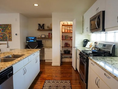 Tons of counter space, walk-in pantry, lots of cabinets, great kitchen with beautiful finishes.