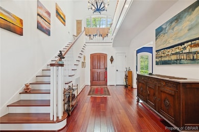 Entrance foyer with gleaming Brazilian hardwood fl