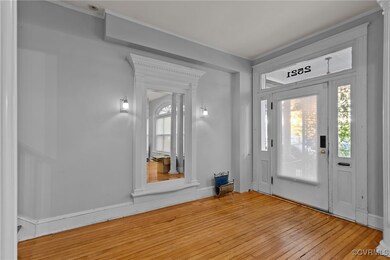 Entrance foyer with hardwood / wood-style flooring
