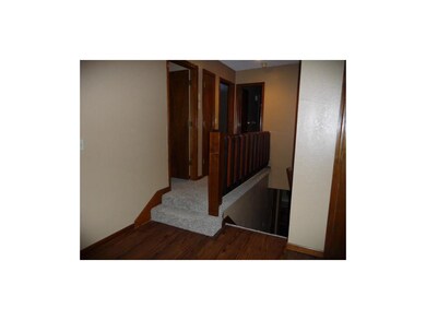 Open hall to bedrooms and bath. Interior entrance 