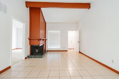 Unfurnished living room with lofted ceiling with b