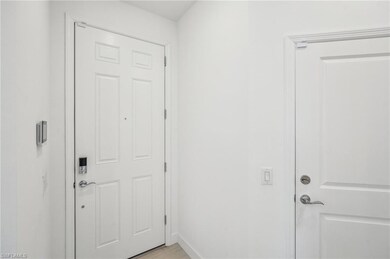 Entryway featuring light tile patterned flooring
