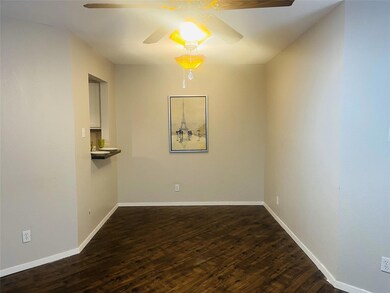 Unfurnished room with dark wood-type flooring and 