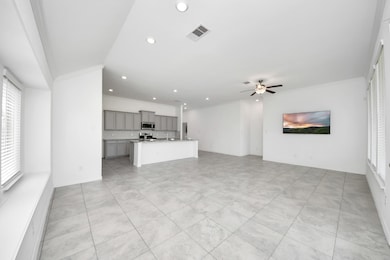 Seamless flow from dining to kitchen and living ar