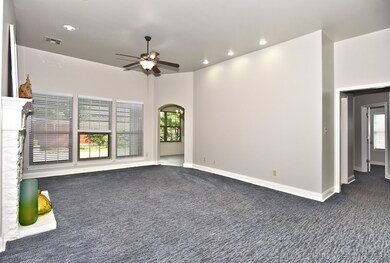 Step inside and admire the spacious living room! T