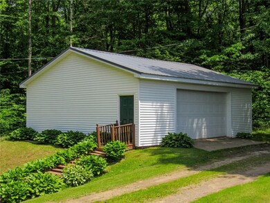 View of garage from dock. Steps leading up to 2-ca