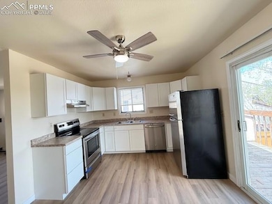 Kitchen with appliances with stainless steel finis