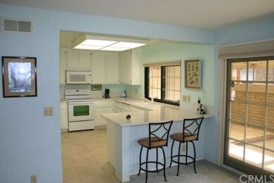 Breakfast bar and upgraded Corian counters are acc