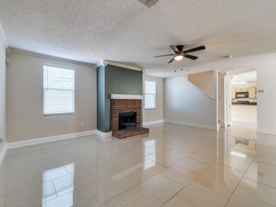 Unfurnished living room with a textured ceiling, c