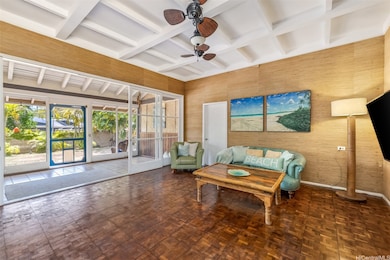 The living room leads to large, screened-in lanai