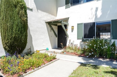 Front entrance with lush landscaping.