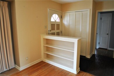 Decorative front door enters into foyer which has 