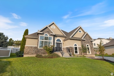 View of front facade with stone siding and stucco siding